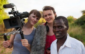 Two female filmmakers next to a man