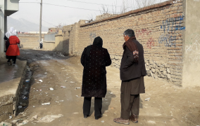 Field researchers identify a sampling starting point for survey pilot in Kabul, Afghanistan.