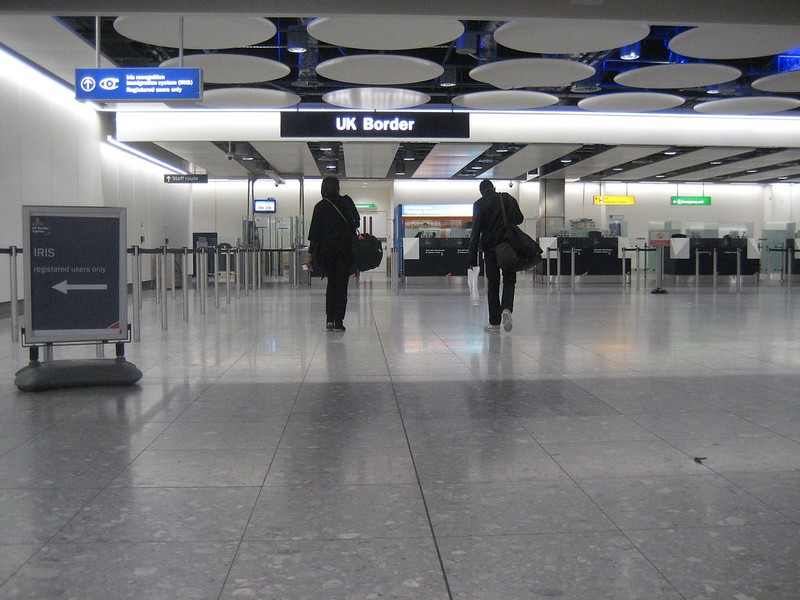 Two people entering the UK border at airport