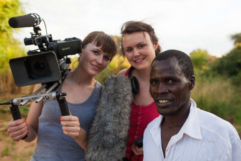 Two female filmmakers next to a man