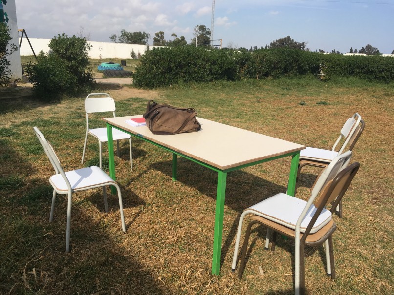 A table and chairs outside for a focus group discussion in Tunisia.