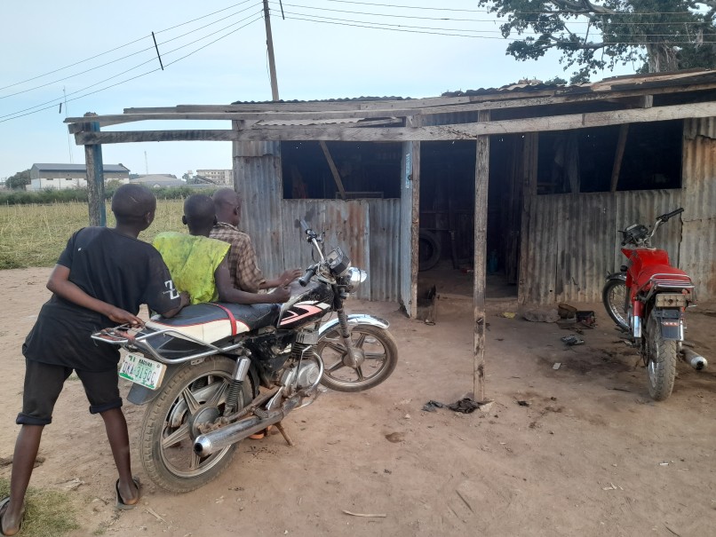 Apprentices at mechanic workshop in Down Quarters