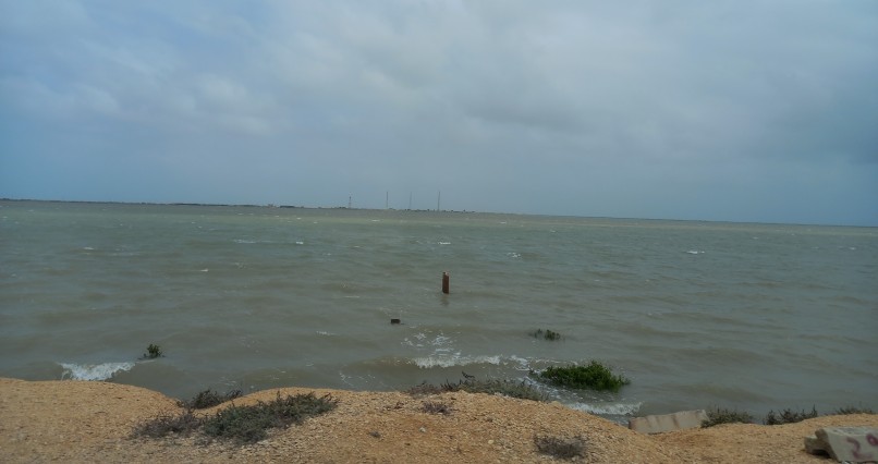 Electricity pole reflecting rise in sea level over time